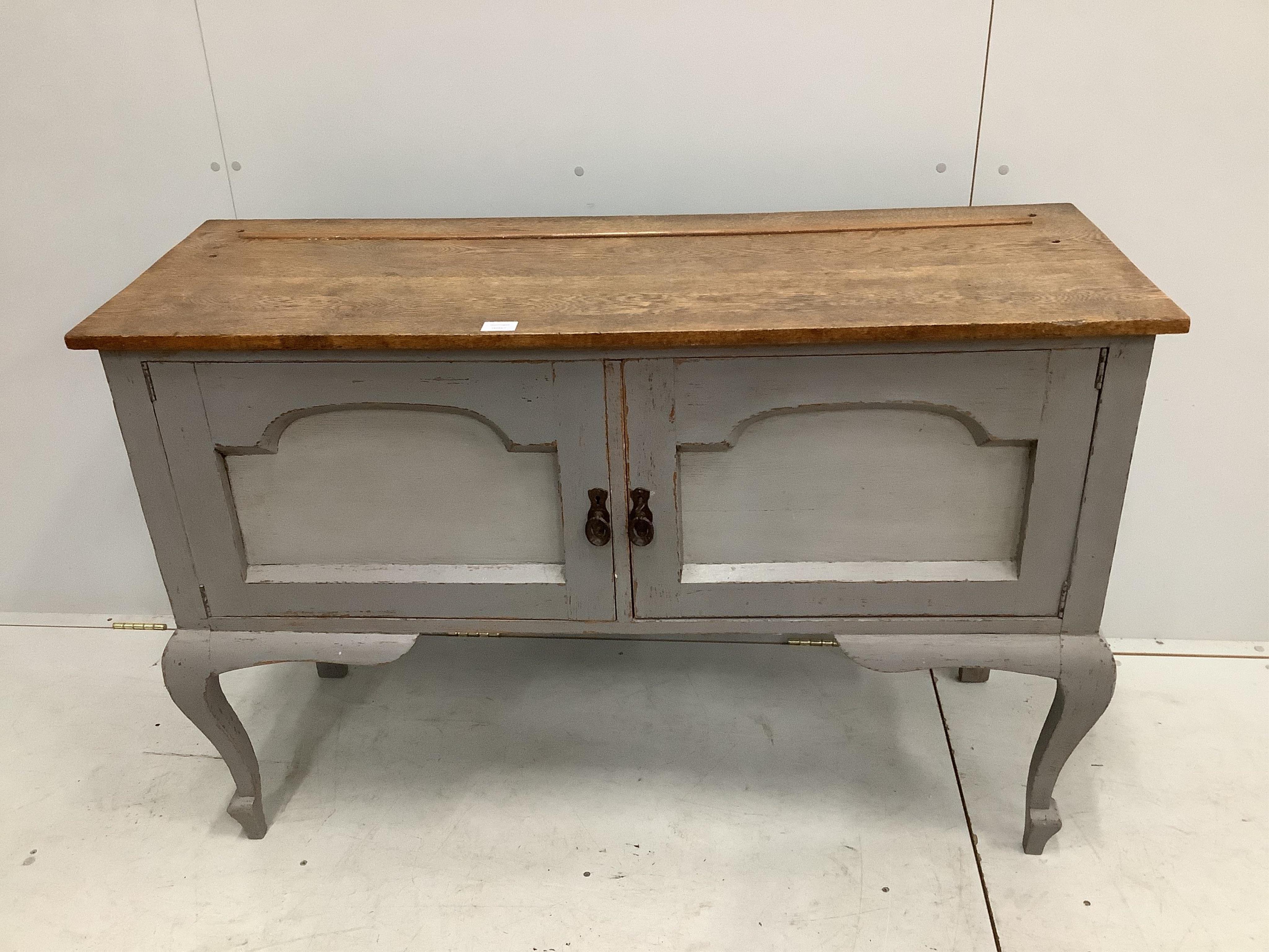 An early 20th century oak low dresser, later painted, width 129cm, depth 47cm, height 86cm. Condition - fair